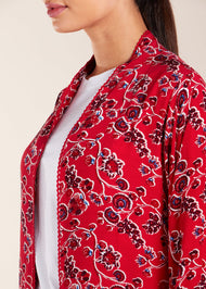 Expertly crafted with a loose fit and delicate lace trim, this kimono style top features small side slits. Perfect for everyday wear, this kimono adds a touch of elegance to any outfit. Pair it with one of our full slips for an elevated look, and take advantage of the convenient discreet side pockets. Red with floral print.