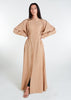 This Maxi Shirt Dress Sand features cuffed sleeves and pockets, giving the appearance of a tucked-in shirt and skirt when it is actually a one-piece outfit. Pleats at the waist create a cinch, while the top half remains loose for a comfortable fit. The dress is cut in an A-line style. Neutral beige tone.