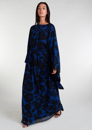 Elevate your evening and garden party attire with the striking Midnight Rose Kaftan, featuring a bold black and blue rose print. Designed with fully lined, dramatic pointed wide sleeves, this kaftan is perfect for special occasions. 